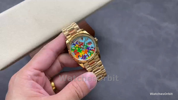 Replica Rolex Day Date 36-128238-0106, oro giallo, lunetta scanalata, quadrante con puzzle Emoji, unisex