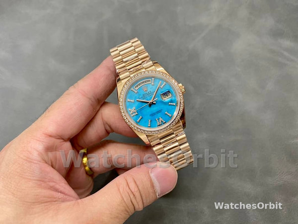 Replica Rolex Day-Date 36-m128345rbr 0064, oro rosa, quadrante romano con diamanti incastonati, lunetta di diamanti quadrante turchese